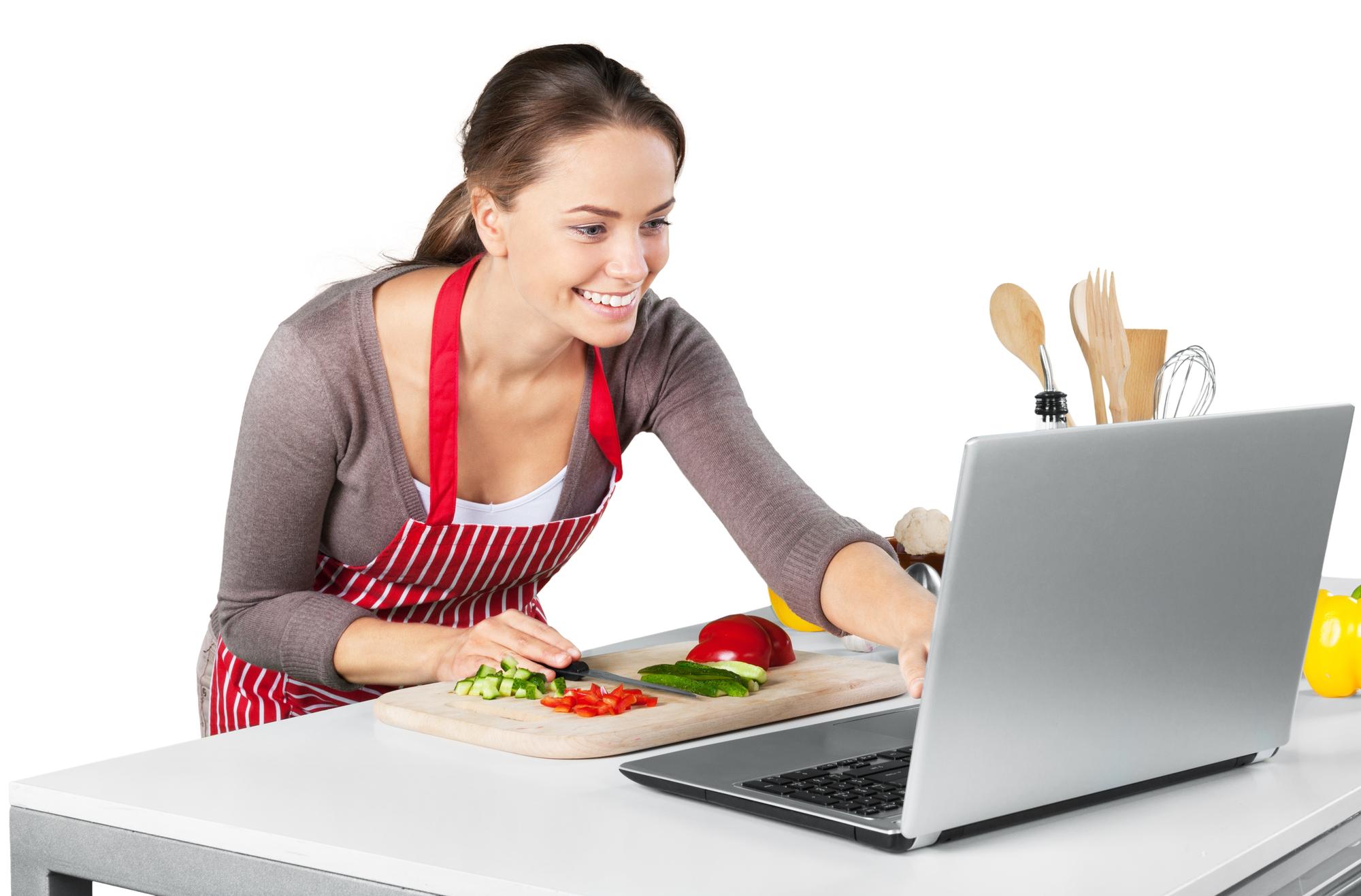 Student cooking with instructor on video call