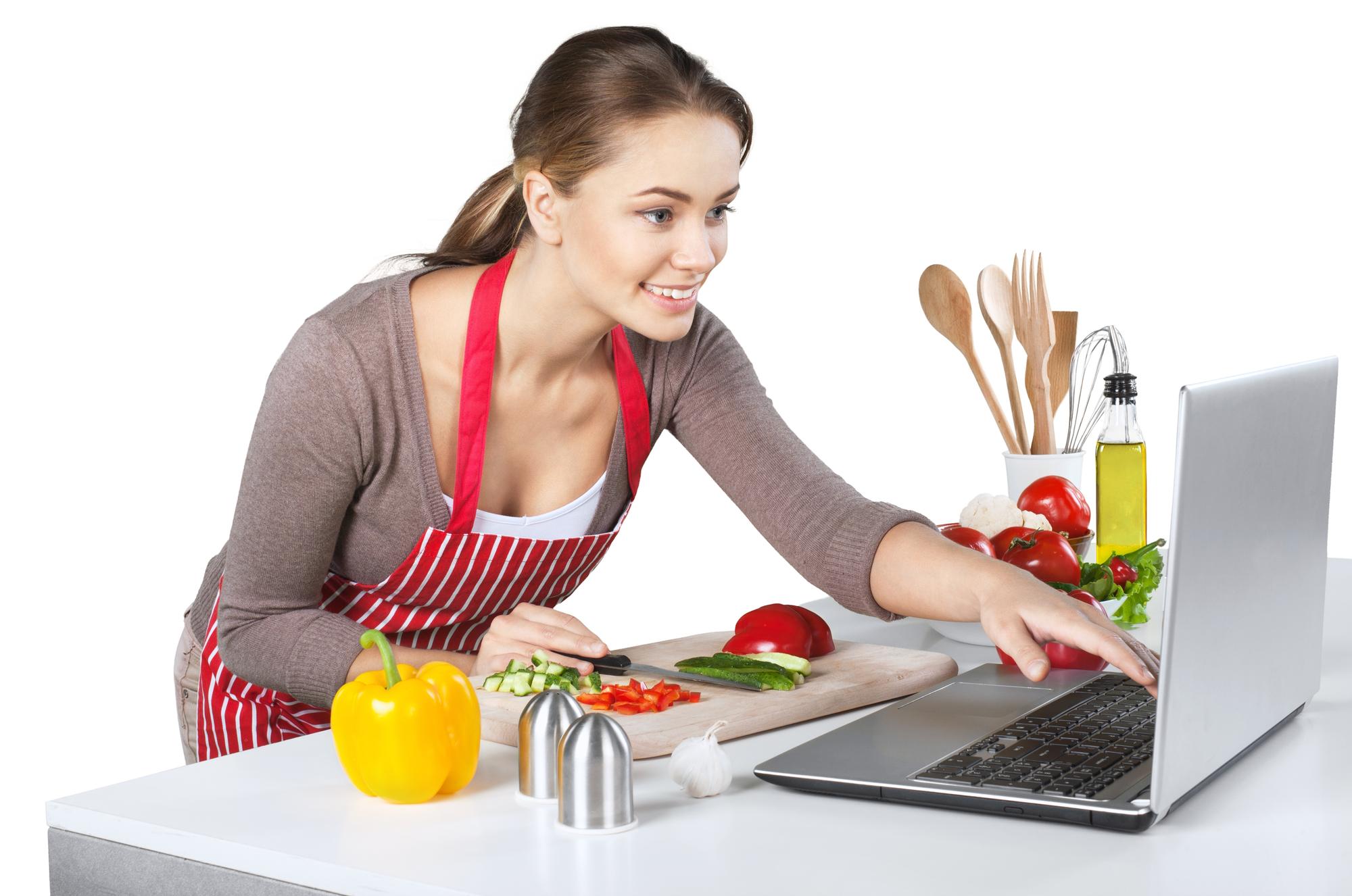 Student cooking at home with laptop